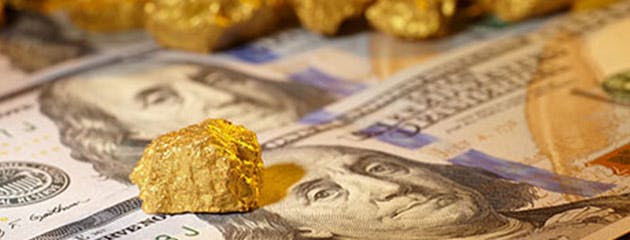 الذهب يستمر في التراجع في ظل قوة الدولار الأمريكي